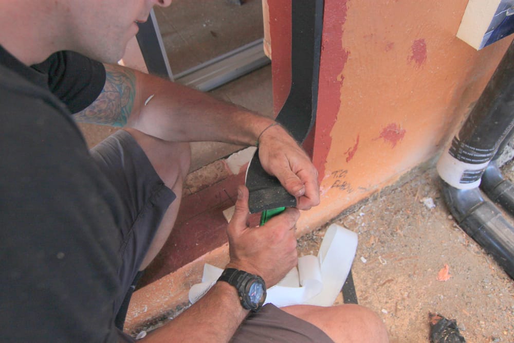 Expanding Foam Tape Gets Installed into Flashed Doorway