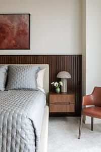 Bedroom with wood paneling