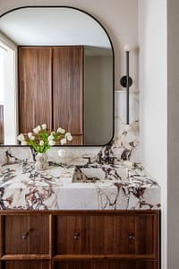 Bathroom sink with waterfalling marble counter