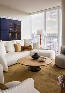 View of living area with white sofa and round table