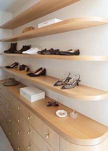 Custom closet cabinets with gold pulls